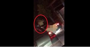 فتاة ترقص فوق سيارة تاكسي وتتعرى أمام المارة!.. فيديو